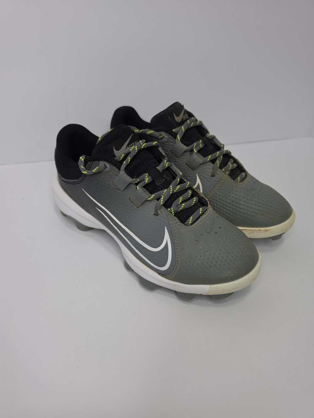 Nike Women’s Gray Athletic Cleats with White Swoosh and Neon Yellow Lace Accents